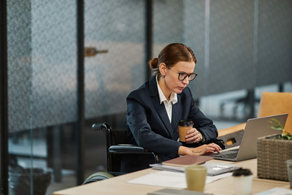 female wheelchair user in modern office VAT penalty system